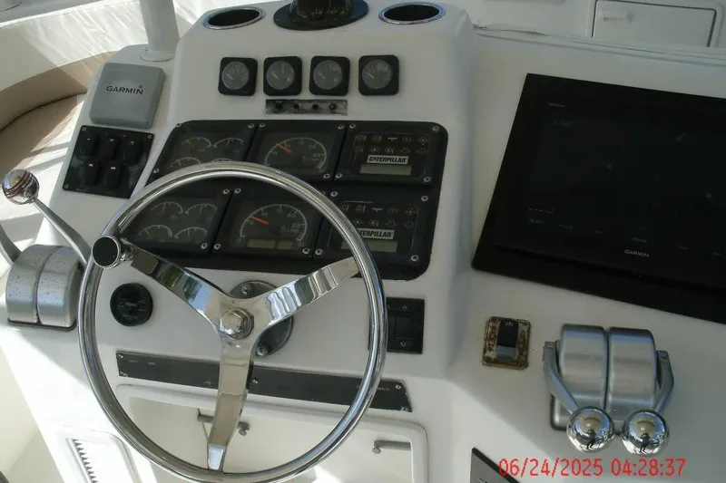  Yacht Photos Pics Control panel of a 1998 Ocean Yachts 48 Super Sport with steering wheel and gauges.