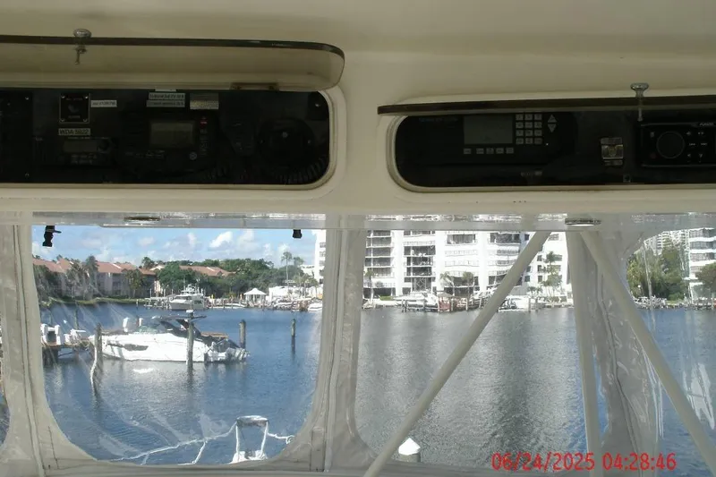  Yacht Photos Pics Interior view from a 1998 Ocean Yachts 48 Super Sport, overlooking a marina.