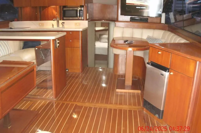  Yacht Photos Pics Luxurious interior of 1998 Ocean Yachts 48 Super Sport with wood finish and modern amenities.