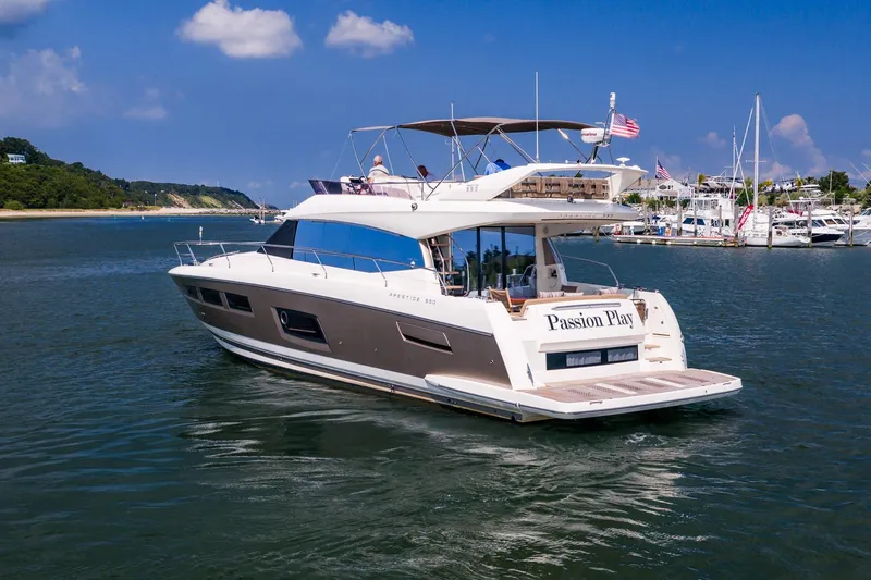 Passion Play Yacht Photos Pics 2014 Prestige Yachts 550 Flybridge cruising in a scenic harbor setting.