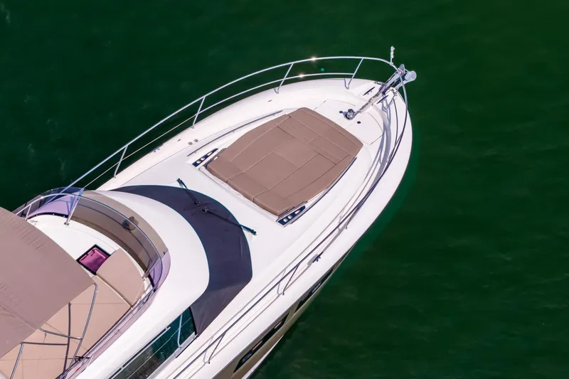 Passion Play Yacht Photos Pics 2014 Prestige Yachts 550 Flybridge, aerial view of bow on green water.