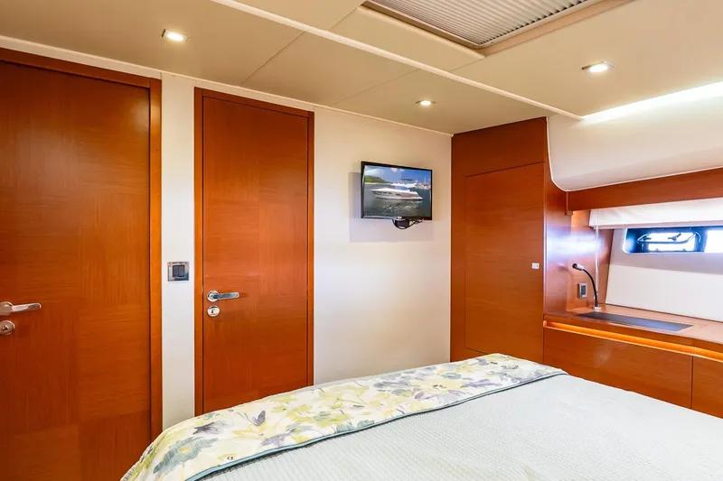 Passion Play Yacht Photos Pics Luxurious cabin interior of 2014 Prestige Yachts 550 Flybridge with wood finishes and modern amenities.