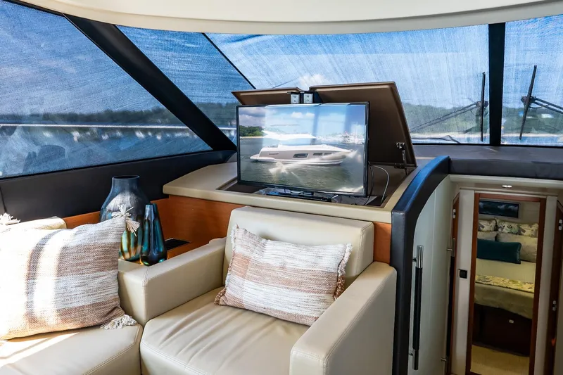 Passion Play Yacht Photos Pics Luxurious interior of 2014 Prestige Yachts 550 Flybridge with plush seating and modern decor.