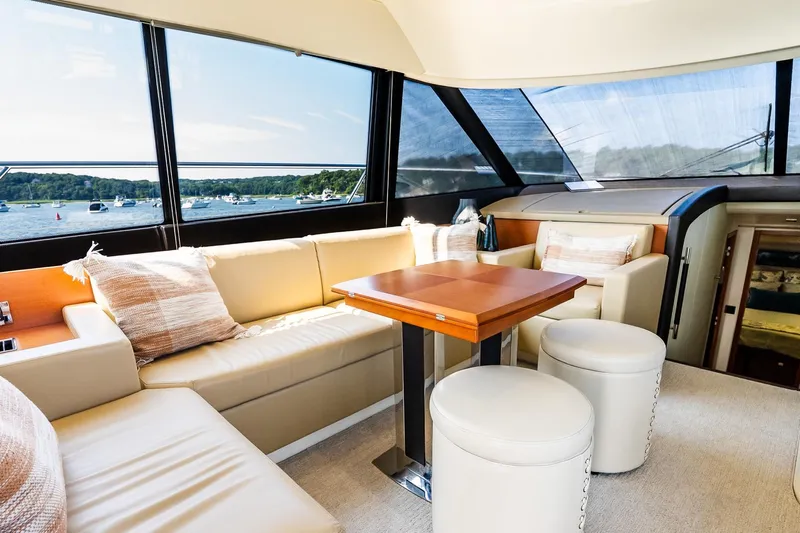 Passion Play Yacht Photos Pics Luxurious interior of 2014 Prestige Yachts 550 Flybridge with scenic water view.