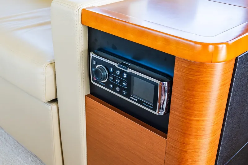 Passion Play Yacht Photos Pics Control panel on 2014 Prestige Yachts 550 Flybridge, featuring sleek wood and leather design.