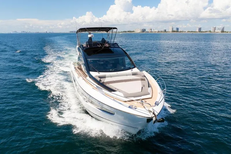  Yacht Photos Pics 2023 Sunseeker 65 Sport Yacht cruising on open water under clear skies.