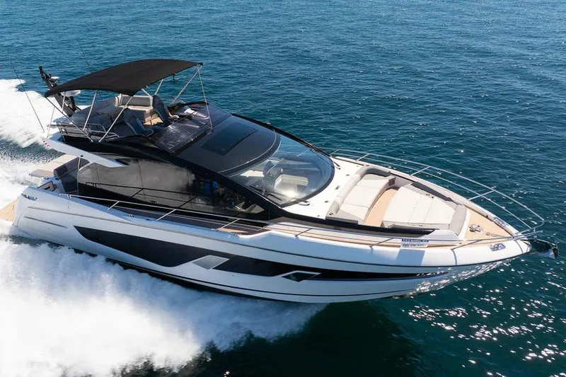  Yacht Photos Pics 2023 Sunseeker 65 Sport Yacht cruising on open water.