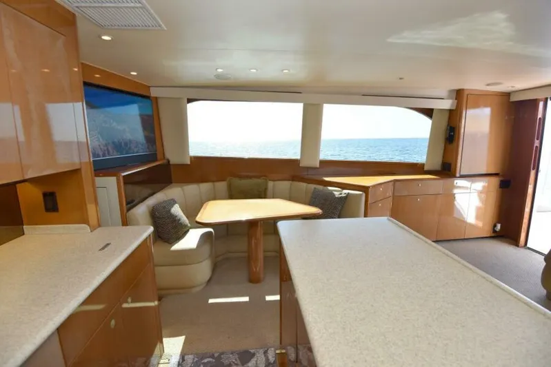 Happy Ending Yacht Photos Pics Luxurious interior of 2000 Viking 55 Convertible yacht with ocean view.