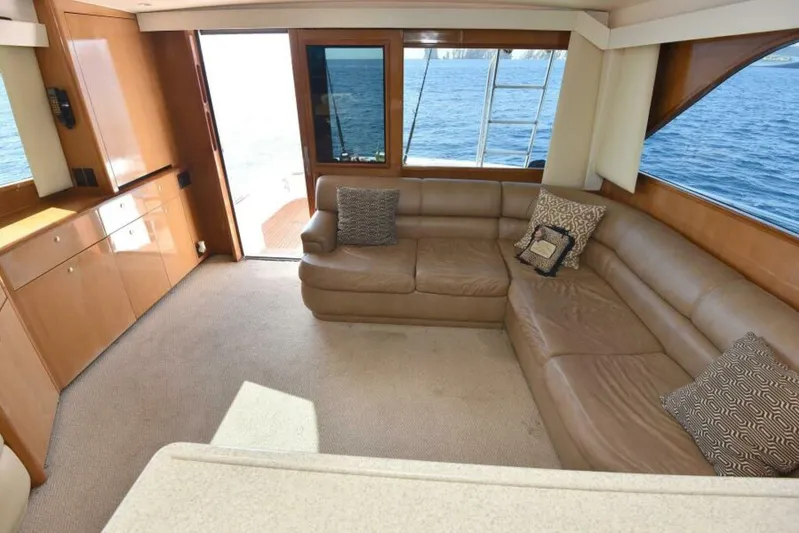 Happy Ending Yacht Photos Pics Luxurious interior of 2000 Viking 55 Convertible yacht with leather seating and ocean view.