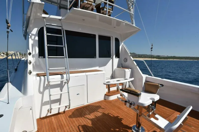 Happy Ending Yacht Photos Pics 2000 Viking 55 Convertible yacht deck with fishing chairs and ocean view.