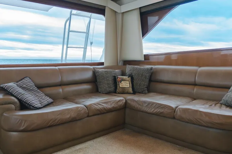 Happy Ending Yacht Photos Pics Luxurious interior of 2000 Viking 55 Convertible yacht with leather seating and ocean view.