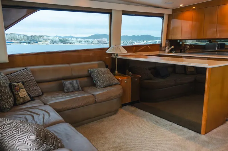 Happy Ending Yacht Photos Pics Luxurious interior of a 2000 Viking 55 Convertible yacht with leather seating and ocean view.