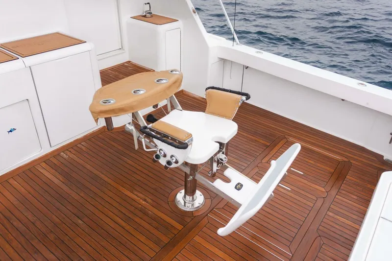 Happy Ending Yacht Photos Pics Viking 55 Convertible 2000 yacht deck with fishing chair and teak flooring.