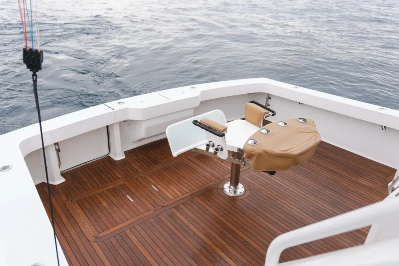 Happy Ending Yacht Photos Pics Viking 55 Convertible 2000 yacht deck with fishing chair and teak flooring.