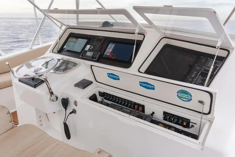 Happy Ending Yacht Photos Pics Control panel of a 2000 Viking 55 Convertible yacht with navigation equipment.