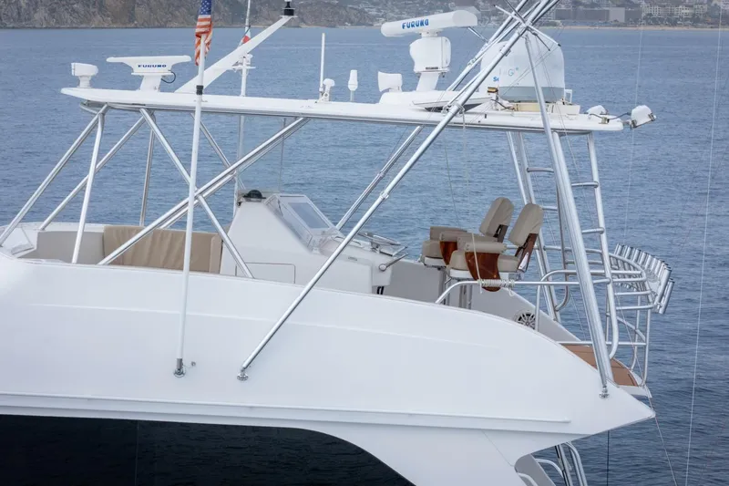 Happy Ending Yacht Photos Pics 2000 Viking 55 Convertible yacht with flybridge, ocean backdrop, and radar equipment.