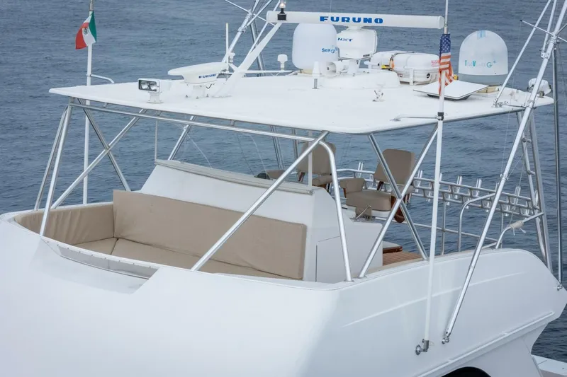 Happy Ending Yacht Photos Pics 2000 Viking 55 Convertible yacht with radar equipment and seating on the flybridge.