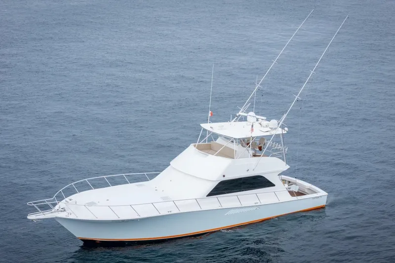 Happy Ending Yacht Photos Pics 2000 Viking 55 Convertible yacht on open water, showcasing sleek design and fishing equipment.