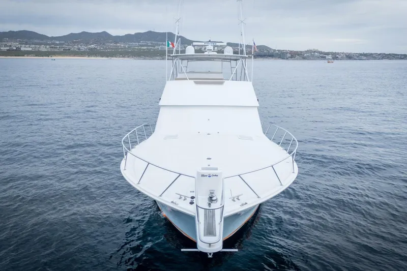Happy Ending Yacht Photos Pics Front view of a 2000 Viking 55 Convertible yacht on calm waters.
