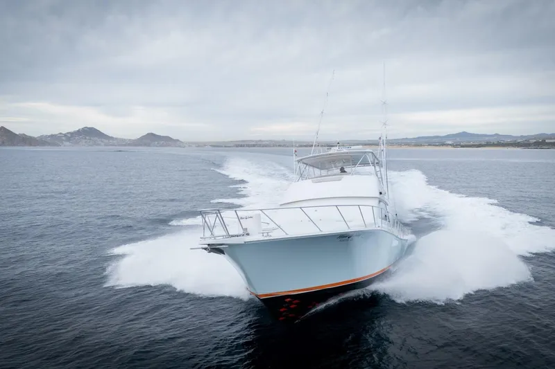 Happy Ending Yacht Photos Pics Viking 55 Convertible yacht cruising on open water, 2000 model.