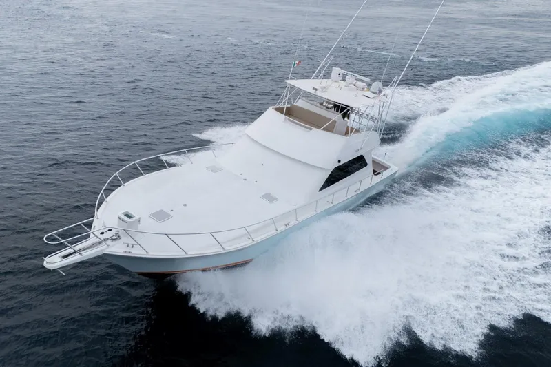 Happy Ending Yacht Photos Pics Viking 55 Convertible 2000 yacht cruising swiftly on open water.