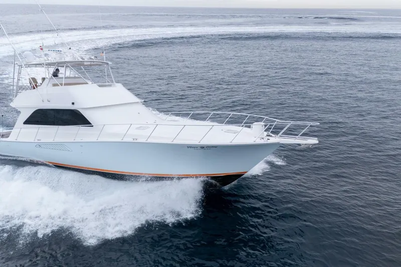 Happy Ending Yacht Photos Pics 2000 Viking 55 Convertible yacht cruising on open ocean waters.