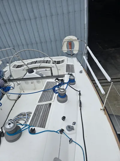 True Blue Yacht Photos Pics Beneteau First 40.7 sailboat deck, 2000 model, featuring winches and steering wheel.