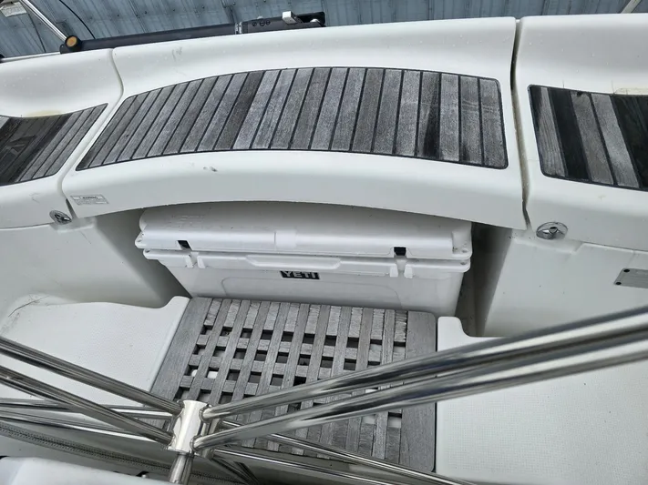 True Blue Yacht Photos Pics Beneteau First 40.7 yacht cockpit with wooden flooring and Yeti cooler, 2000 model.