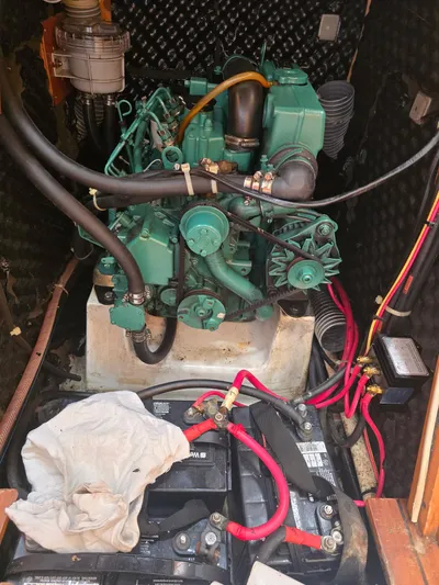 True Blue Yacht Photos Pics Engine compartment of a 2000 Beneteau First 40.7 sailboat, featuring wiring and components.