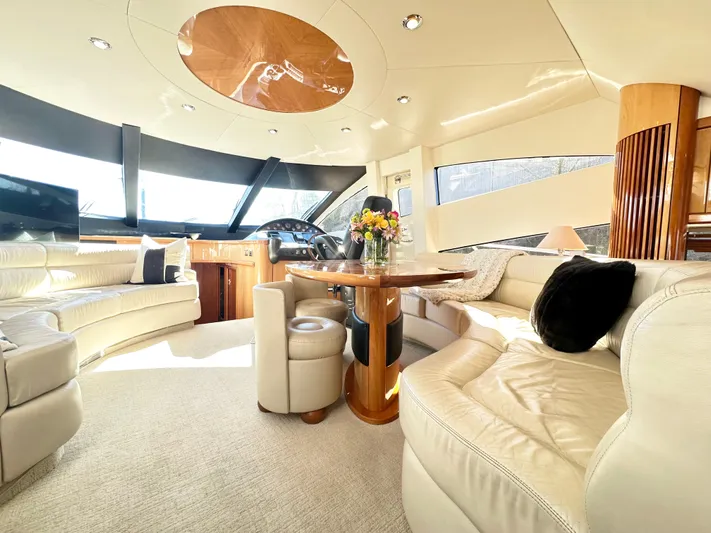 Lai Lani Yacht Photos Pics Luxurious interior of a 2005 Sunseeker Manhattan 66 yacht with elegant seating and decor.