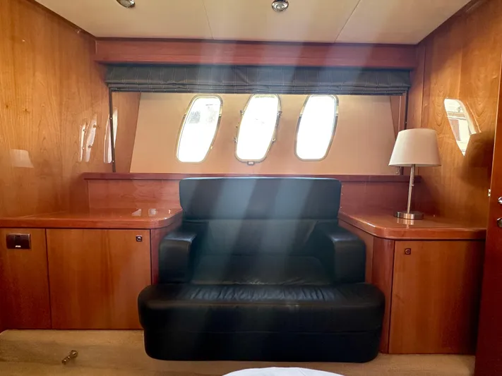 Lai Lani Yacht Photos Pics Luxurious interior of 2005 Sunseeker Manhattan 66 yacht with leather seating and wood paneling.