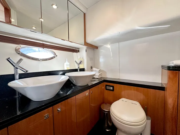 Lai Lani Yacht Photos Pics Luxurious bathroom in 2005 Sunseeker Manhattan 66 yacht with dual sinks and modern fixtures.