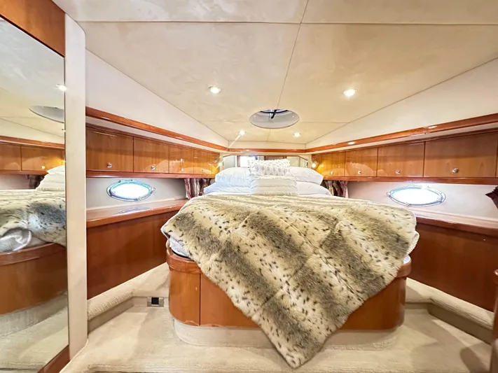 Lai Lani Yacht Photos Pics Luxurious bedroom interior of 2005 Sunseeker Manhattan 66 yacht with plush bedding.
