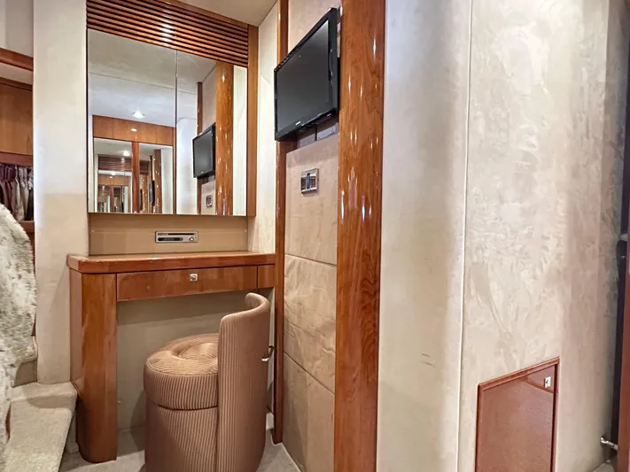 Lai Lani Yacht Photos Pics Luxurious interior of 2005 Sunseeker Manhattan 66 yacht with vanity and seating.