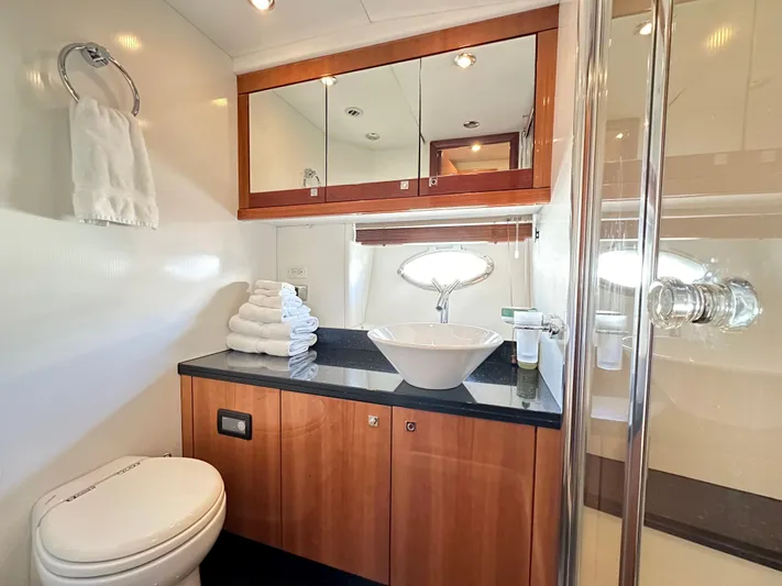 Lai Lani Yacht Photos Pics Luxurious bathroom in 2005 Sunseeker Manhattan 66 yacht with modern fixtures and elegant design.