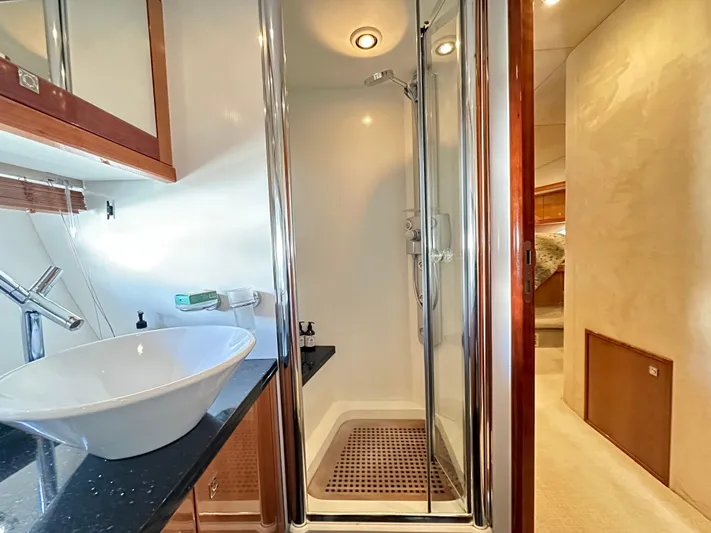 Lai Lani Yacht Photos Pics Luxurious bathroom in 2005 Sunseeker Manhattan 66 yacht with modern shower and sink.