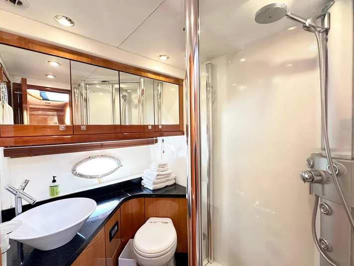 Lai Lani Yacht Photos Pics Luxurious bathroom in 2005 Sunseeker Manhattan 66 yacht with modern fixtures and elegant design.