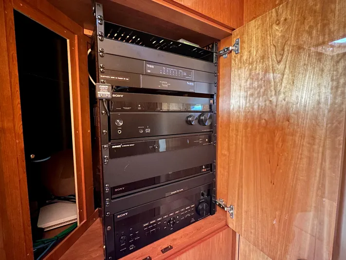Lai Lani Yacht Photos Pics Audio equipment cabinet inside a 2005 Sunseeker Manhattan 66 yacht.