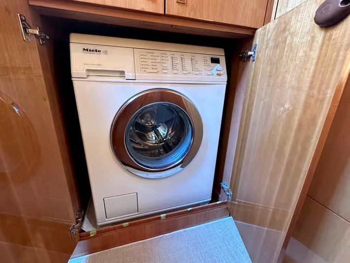 Lai Lani Yacht Photos Pics Miele washing machine in a 2005 Sunseeker Manhattan 66 yacht's wooden cabinet.