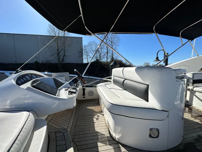 Lai Lani Yacht Photos Pics 2005 Sunseeker Manhattan 66 yacht interior with sleek seating and modern controls.