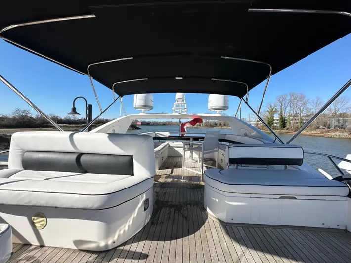 Lai Lani Yacht Photos Pics 2005 Sunseeker Manhattan 66 yacht with spacious deck and seating under canopy.