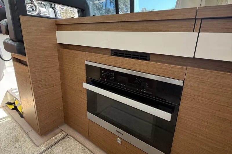 Yacht Photos Pics Modern kitchen area in 2020 Jeanneau NC 37 boat with built-in oven.