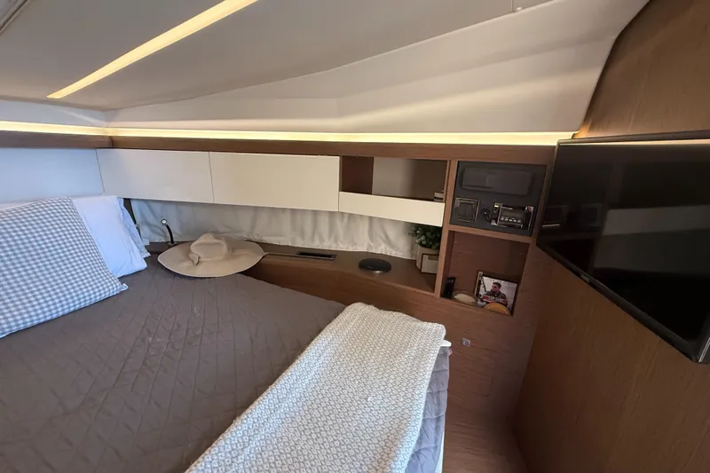  Yacht Photos Pics Luxurious cabin interior of 2020 Jeanneau NC 37 yacht with modern amenities.
