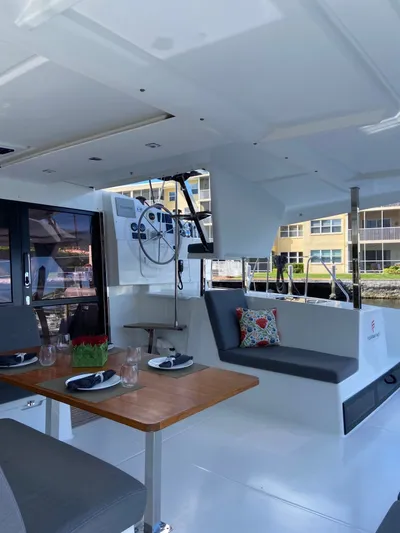 Seas The Day Yacht Photos Pics 2023 Fountaine Pajot Isla 40 yacht interior with dining area.