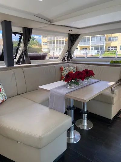 Seas The Day Yacht Photos Pics Interior of 2023 Fountaine Pajot Isla 40 yacht with elegant seating area.