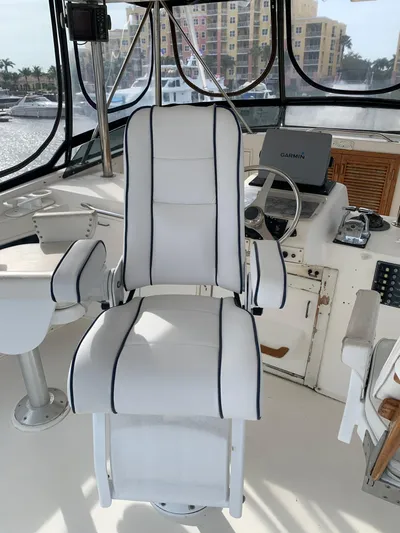 Lolly Yacht Photos Pics Captain's chair on 1985 Ocean Yachts 55 Super Sport boat, helm station view.