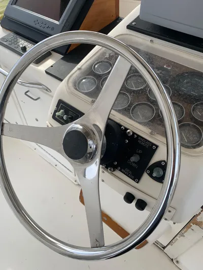 Lolly Yacht Photos Pics 1985 Ocean Yachts 55 Super Sport helm with steering wheel and navigation instruments.