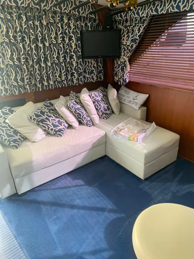 Lolly Yacht Photos Pics Interior of 1985 Ocean Yachts 55 Super Sport with cozy seating area and nautical decor.