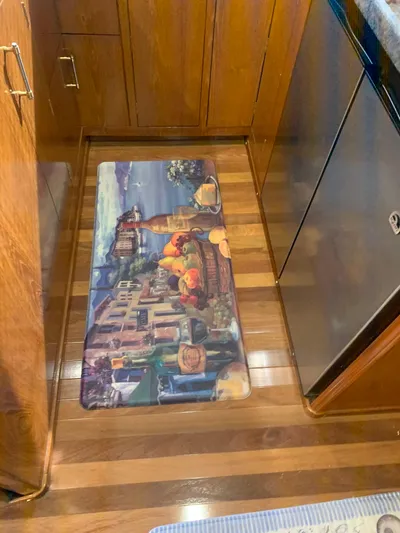 Lolly Yacht Photos Pics Galley kitchen in 1985 Ocean Yachts 55 Super Sport with decorative floor mat.