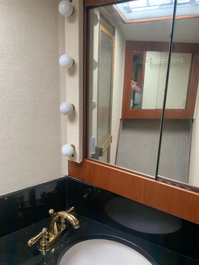 Lolly Yacht Photos Pics 1985 Ocean Yachts 55 Super Sport bathroom with vanity and mirror.